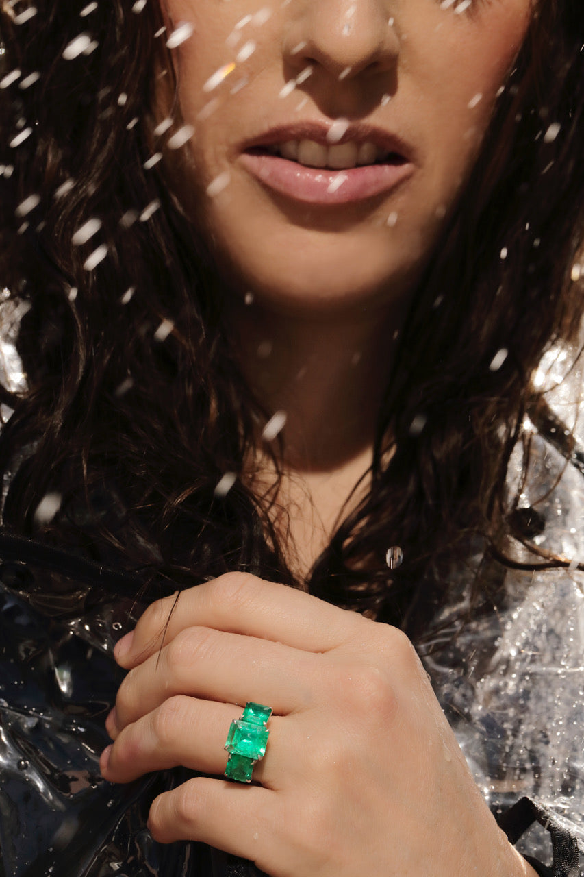 Image of model wearing an emerald ring