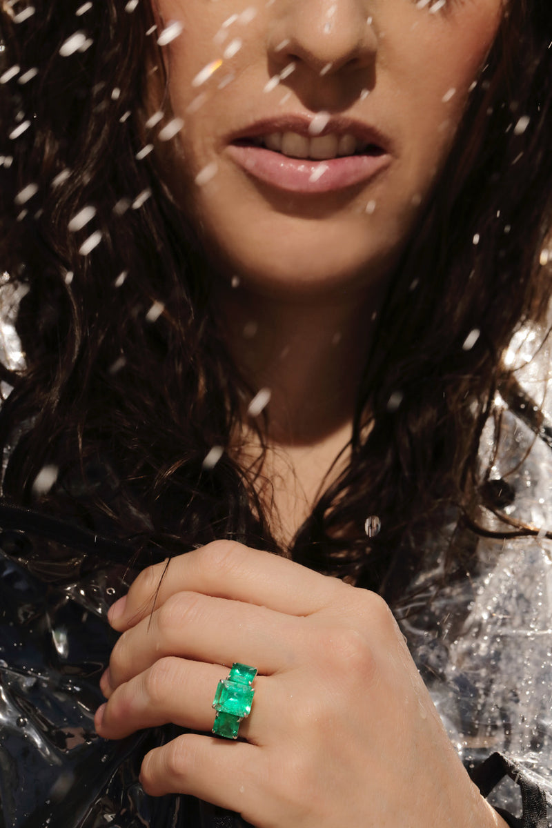 Image of model wearing an emerald ring