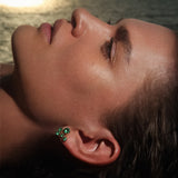 Maria Jose Jewelry Constellation Earrings image of emerald earring on model laying down closeup view