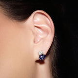 Maria Jose Jewelry Double Oval Diamond and Sapphire Earrings on model's left ear