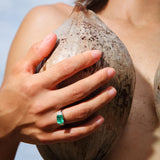 Maria Jose Jewelry East West Colombian Emerald Ring on model holding fruit wearing ring