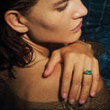 Maria Jose Jewelry East West Colombian Emerald Ring on model touching shoulder