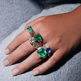 Maria Jose Jewelry East West Colombian Emerald Ring on model's hand wearing other rings