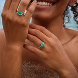 Maria Jose Jewelry East West Colombian Emerald Ring on model's right hand