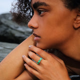 Maria Jose Jewelry East West Three Stone Ring on model laying on a rock