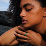 Maria Jose Jewelry East West Three Stone Ring on model's left hand