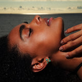 Maria Jose Jewelry Emerald Constellation Earrings on model laying down