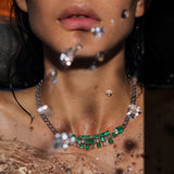 Maria Jose Jewelry Emerald Diamond Necklace on model splashing water