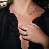 Maria Jose Jewelry Five Diamond Ring on model's left hand