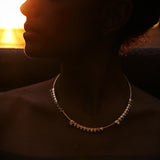 Maria Jose Jewelry Floating Diamond Necklace on model in the dark