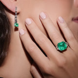 Maria Jose Jewelry Step Cut Drop Emerald and Diamond Earrings on model's right ear detail view