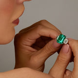 Maria Jose Jewelry Emerald and Diamond Three Stone Ring Model Holding in Hand