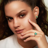 Maria Jose Jewelry Emerald Solitaire Ring on Model Left Hand with Emerald Earring